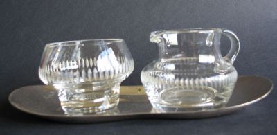 Creamer/milk jug and sugar bowl on white metal tray
Individual size. Olive cuts. Unknown
Keywords: sold;table;cut