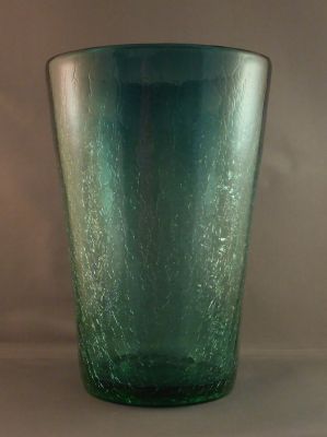 Teal blue crackle bucket vase
Lead crystal, so likely English and possibly Stevens and Williams. Lovely ombre effect. 8 x 5.5 in.
Keywords: blown;british;vase