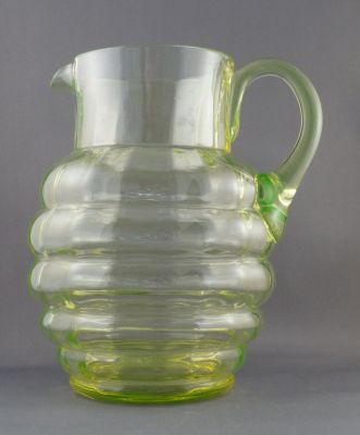 Ribbed water jug with vertical optic ribbing
Clayton Mayers Frinton? No 804 (green), large http://www.victorianpressedglass.com/pdf/clayton_mayers.pdf
Keywords: barware;blown