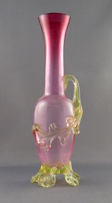 Graduated cranberry vase with uranium leaf and feet
Optic-ribbed. British?
Keywords: blown;british;vase