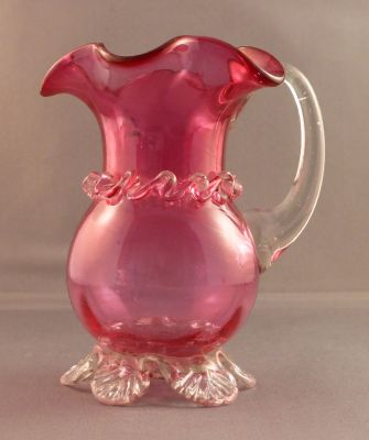 Victorian cranberry creamer
4.5 in. tall. Optic ribbing. Seeds and striations. Likely English
Keywords: table;sold;British