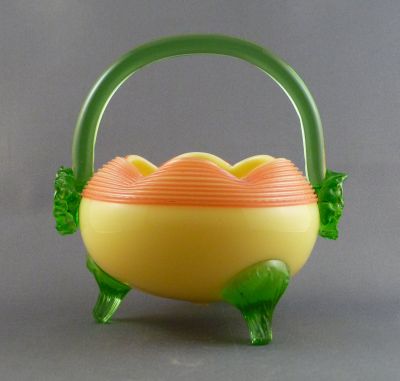 Mills, Walker & Co. custard glass preserve basket with green uranium trim
Rose bowl shape. Pink threading (Seen at Broadfield House with acorn feet and no handle, registered design)
Keywords: blown;vase;british