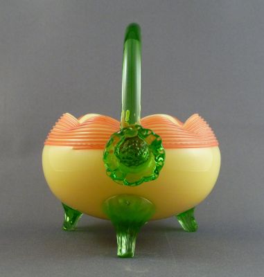 Mills, Walker & Co. custard glass preserve basket with green uranium trim
Mills, Walker & Co. of Wordsley, Stourbridge. Sharp pontil mark. Rosettes on handles.
Keywords: blown;vase