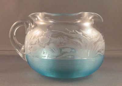 Threaded and engraved creamer/milk jug
Engraved with water lilies and other water plants. Some of the engraving has been polished to give depth
Keywords: table;british;engraved