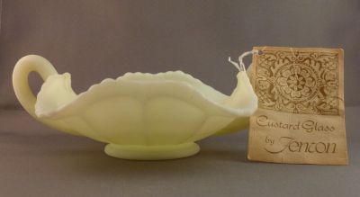 Fenton Butterflies nappy/bonbon
Original glassblower label and hang tag. Very thick glass. Uranium satin custard glass. 1972-85 but probably earlier rather than later
Keywords: american;pressed;table