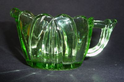Green glass creamer/milk jug
Small. Unknown
Keywords: sold;pressed;table