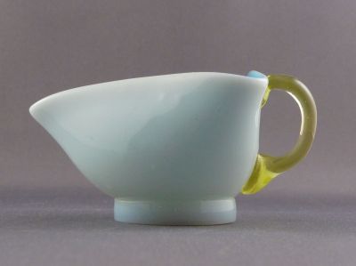 Milk glass mini creamer/milk jug
Bohemian? Applied foot; rough ground pontil mark. Uranium
Keywords: blown;table;czech