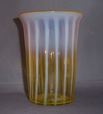 Webb? amber uranium opalescent stripe vase
Star cut and flat polished base. 16 ribs
Keywords: british;blown;vase