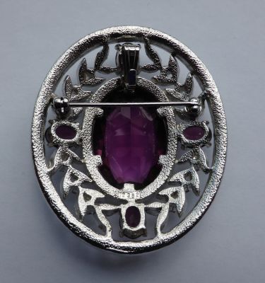 Faux amethyst and diamond brooch/pendant
Fitting for chain. Back marked 2352
Keywords: sold