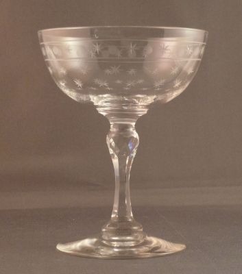 Champagne coupe, star cut with star and circle band
Cut stem with faceted knop. Lead crystal
Keywords: cut;sold;barware