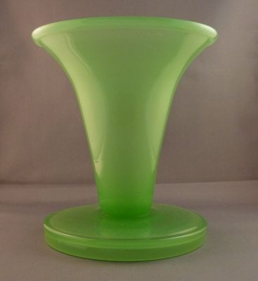 Stevens and Williams jade Jacobean vase
7 in. Folded rim and foot. Design registered by Thomas West Carnie on 5 June 1909. In S&W pattern book for 1923 as 53254. Also made by Whitefriars in a smaller ribbed form. 
Keywords: british;vase;blown